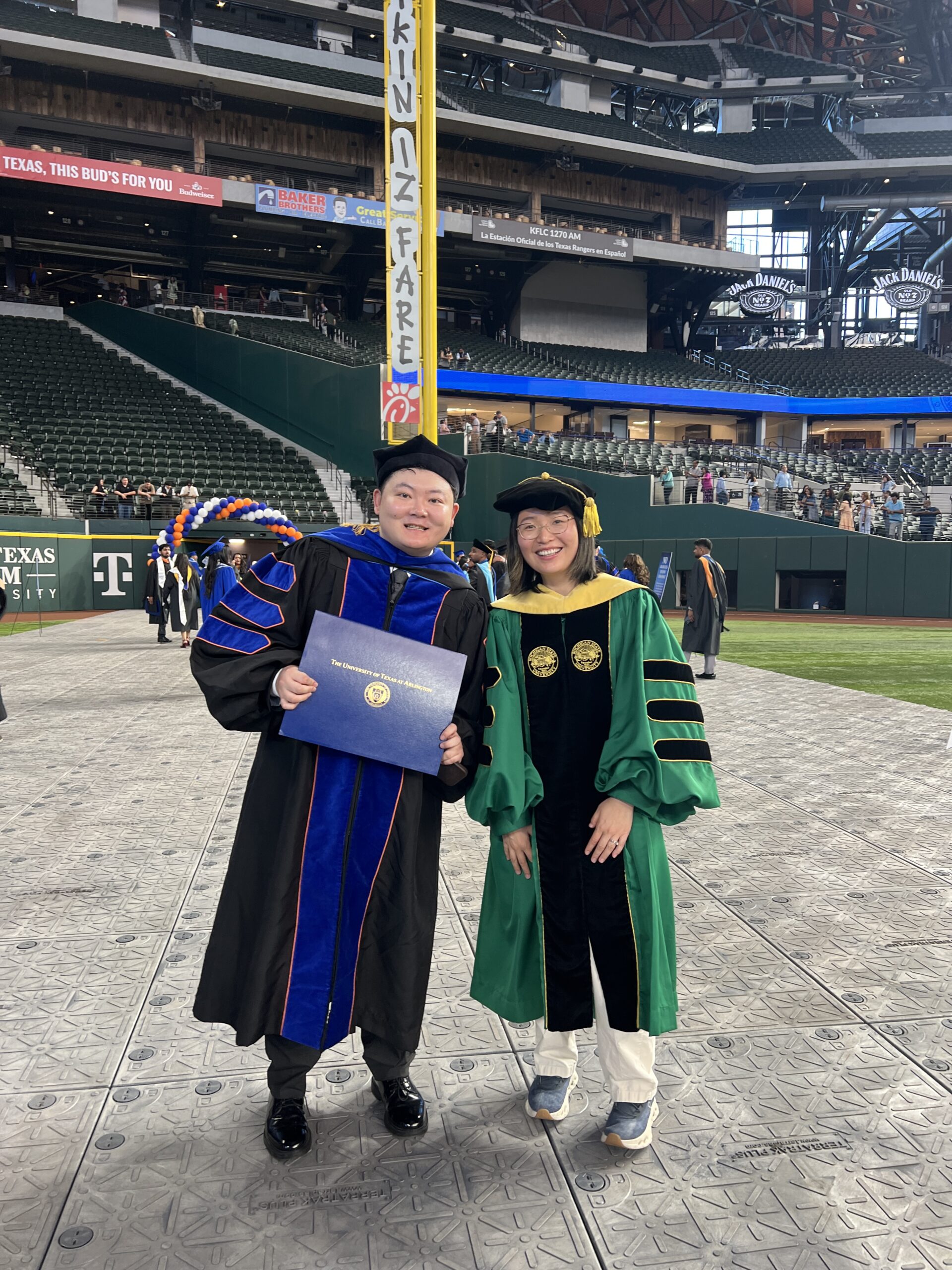 Celebrating my Ph.D. graduation with Dr. Yike Shen